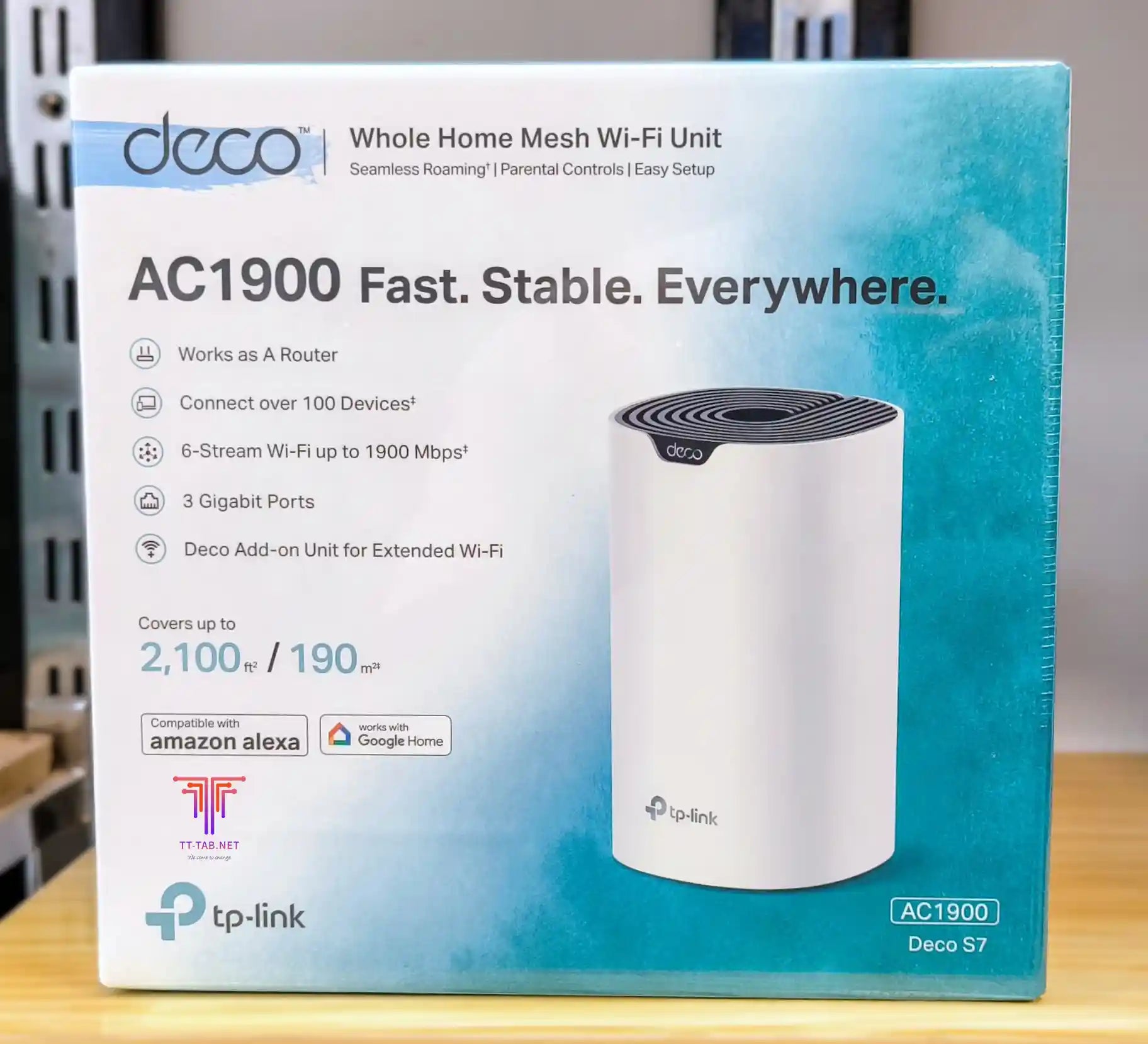 TP-Link Deco S7 Whole Home Mesh Wi-Fi Unit packaging on a wooden surface