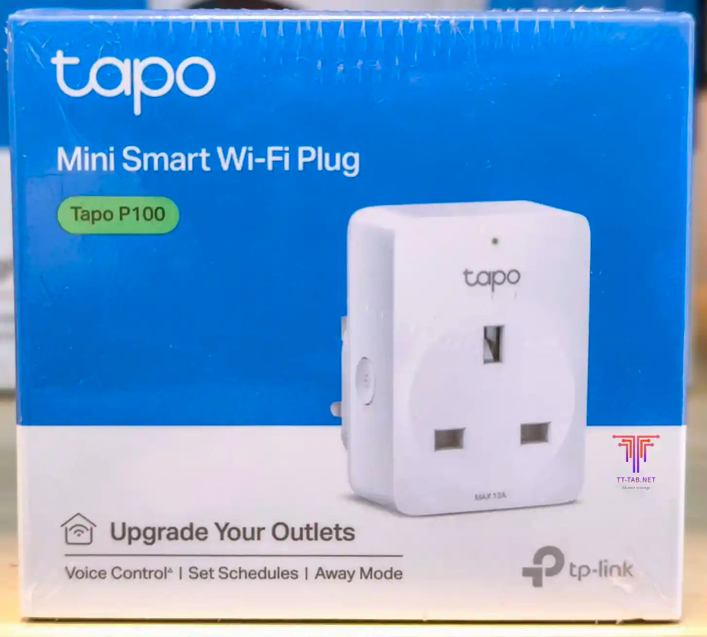 TP-Link Tapo P100 mini smart Wi-Fi plug packaging on a blue background