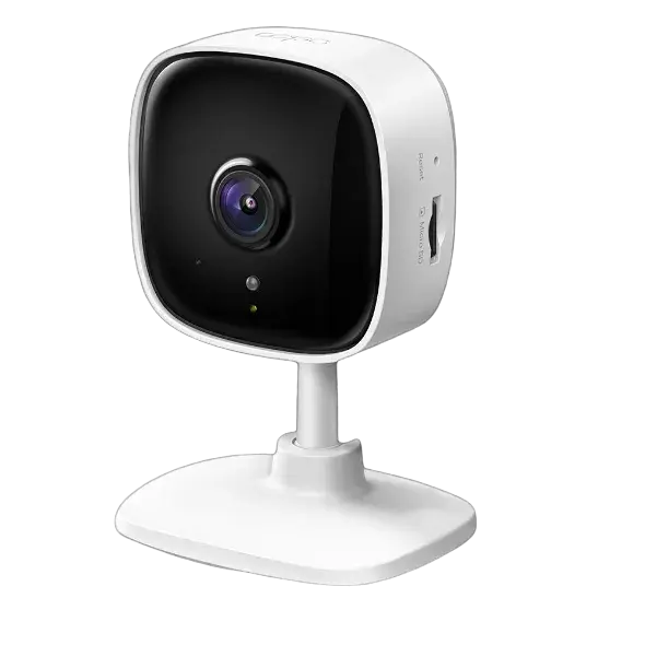 TP-Link Tapo TC60 Home Security Wi-Fi Camera, white color, with a modern design featuring a lens at the center and a flat base for placement.