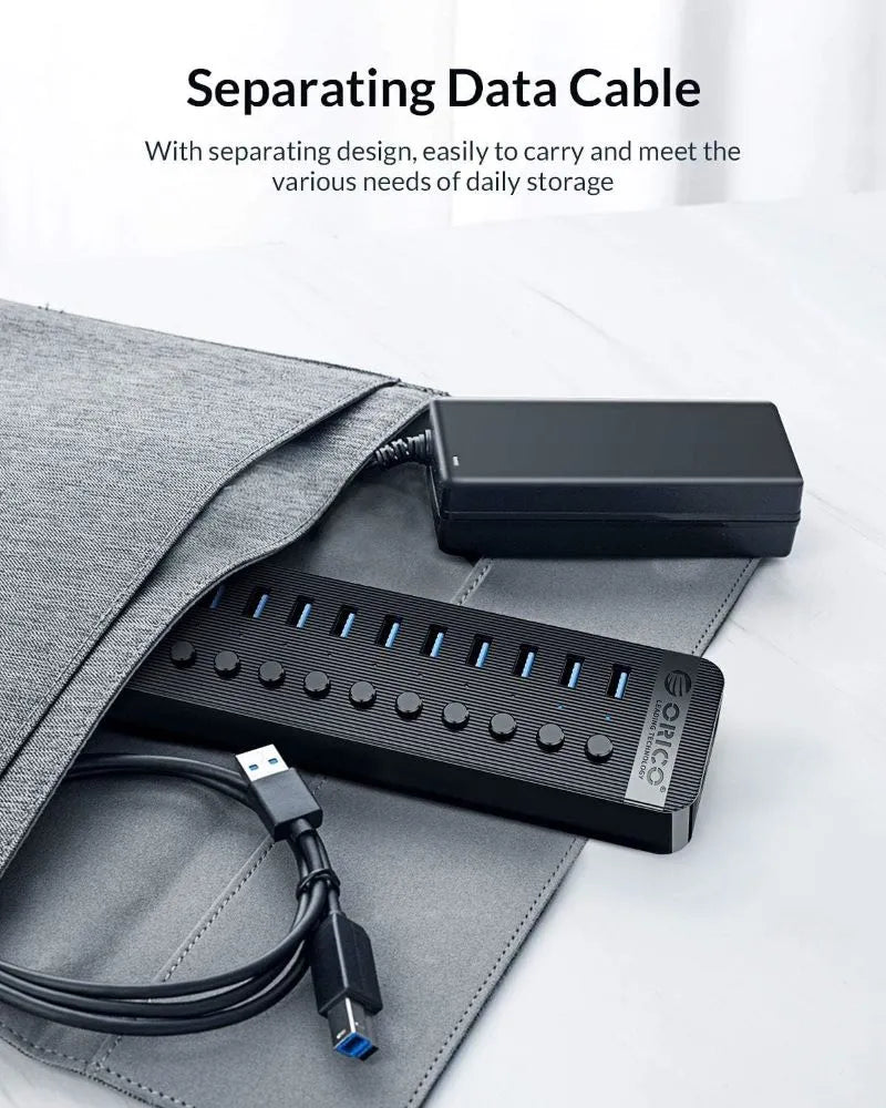 Black USB hub with cable on a gray surface, featuring text about separating data cable design.